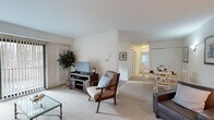 Located at 101 Steuben Dr. in Guilderland, NY, this well-appointed single-floor residence offers two bedrooms and two bathrooms within a thoughtfully designed layout. The open living area is warm and inviting, featuring light-toned carpeting, neutral walls, and a seamless flow into the dining space — ideal for both relaxed living and entertaining. A front entry leads directly into the living room, which receives natural light and offers a comfortable, functional arrangement.

The U-shaped kitchen is a practical highlight, outfitted with white cabinetry, granite-style countertops, hardwood flooring, and a window overlooking a wooded backdrop. Appliances including a range, dishwasher, and refrigerator are all included.

The spacious primary bedroom is bright and serene, with carpeted floors, a window with vertical blinds, and ample room for furnishings. The second bedroom is cozy and well-proportioned, featuring a closet and soft carpeting. Both bathrooms are clean and functional — one includes a tub/shower with a vanity and tile flooring, while the other offers a streamlined vanity with a large mirror. A dedicated closet provides additional storage. The overall ambiance is clean, comfortable, and move-in ready.