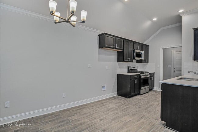 Building Photo - "Charming 3-Bedroom Oasis with Granite Ele...