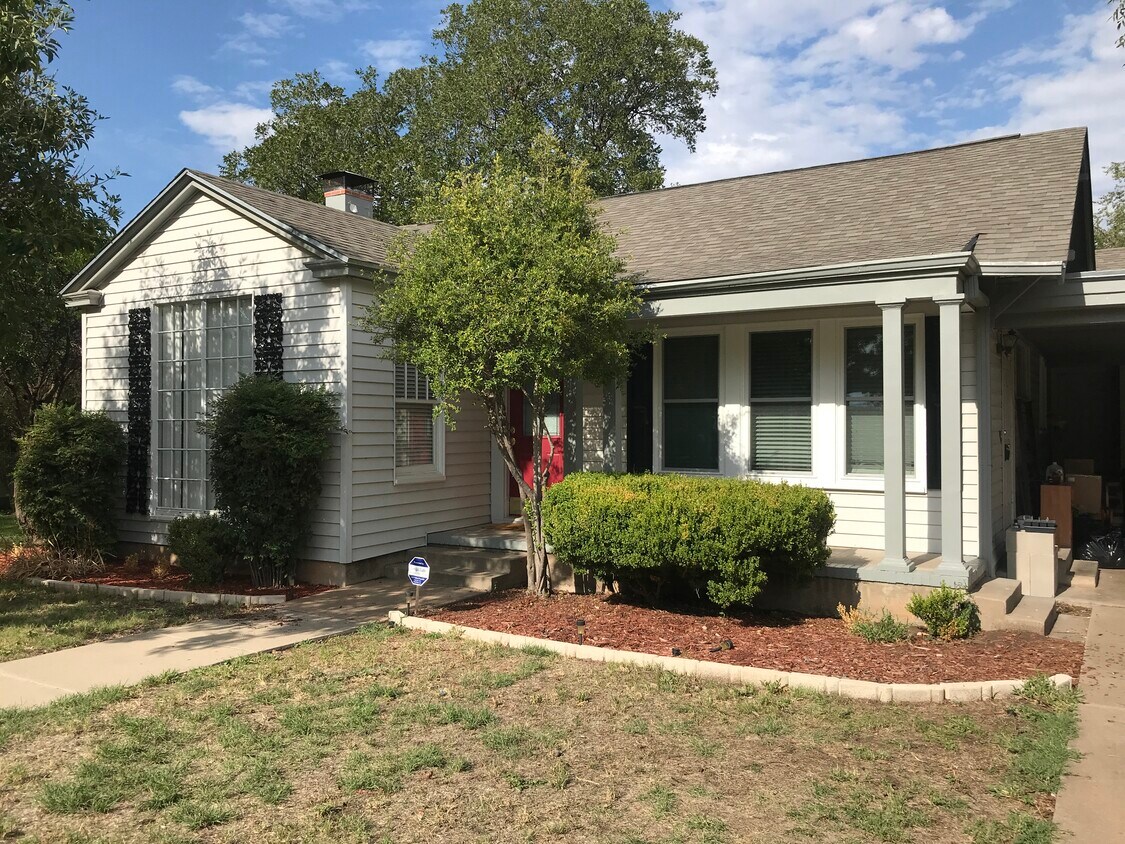 View of the front of the house from the driveway. - 214 S Bishop St