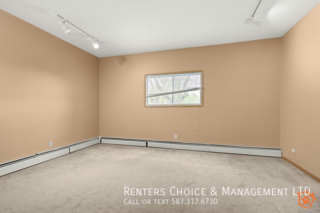 Building Photo - MAIN FLOOR UNIT With Assigned Parking