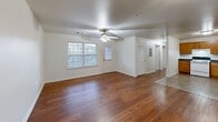 Located at 904 Knotty Oak Way in Knoxville, Tennessee, this single-story, three-bedroom, two-bathroom home offers a practical and comfortable layout. The open living room serves as the heart of the home, featuring warm hardwood flooring, a ceiling fan, and windows that invite natural light into the space. It connects seamlessly to a well-equipped kitchen outfitted with honey-toned oak cabinetry, dark granite-style countertops, a double-basin sink, and white appliances including a range, dishwasher, and refrigerator. Tile flooring grounds the kitchen area with durability and easy maintenance. The three bedrooms are carpeted for comfort, each featuring ceiling fans and closet access. The spacious primary bedroom includes its own closet and offers a quiet, functional retreat. The two full bathrooms are finished with tile flooring and include standard tub-shower combinations and clean white fixtures. A central hallway connects the private areas of the home, while additional closets provide practical storage. The overall design is clean and neutral, offering a versatile canvas throughout.