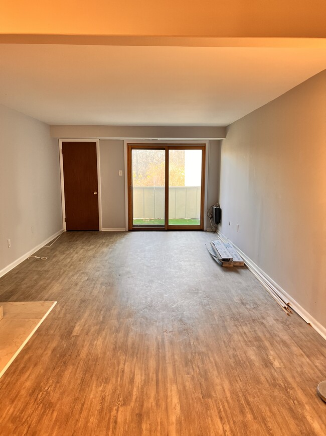 View from dining room to family room with walkout deck - 493 Summit House