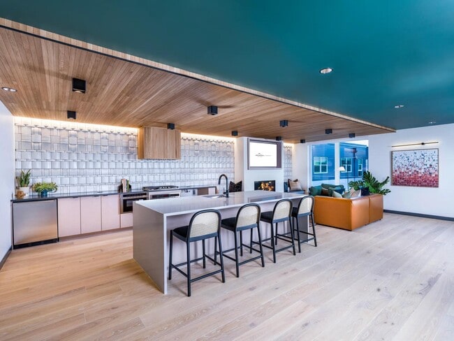 On the fifth floor, you'll find a clubroom featuring a TV lounge and a complete demonstration kitchen. - Modera Woodstock