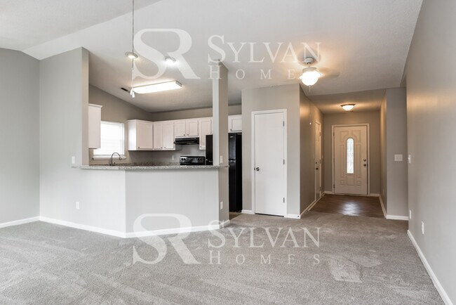 Building Photo - This home exudes a cheerful and welcoming charm!