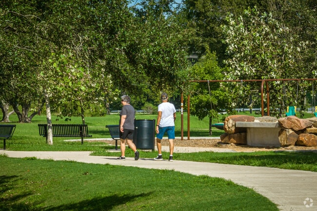 Pearland walkers enjoy a sunny day in the park.