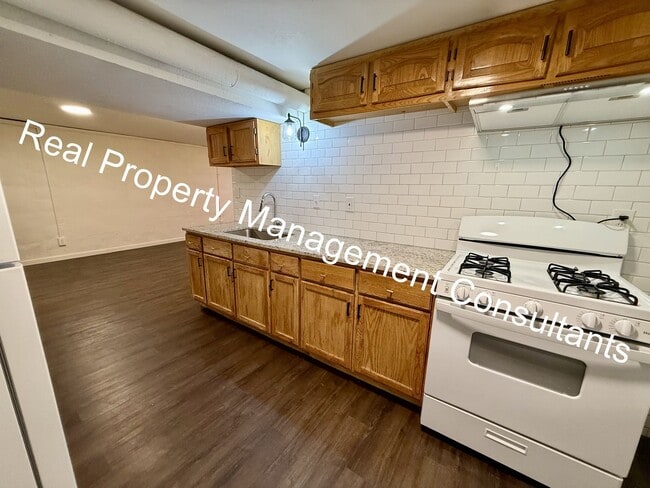 Building Photo - Cozy 2-Bedroom Lower-Level Home – All Util...