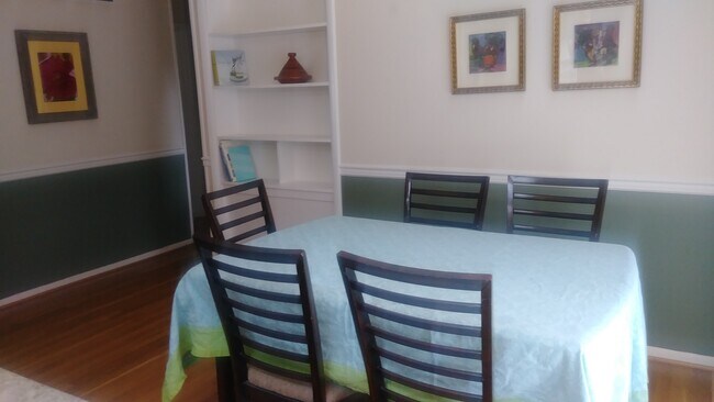 Dining room opens to kitchen and back deck - 215 Hutton St