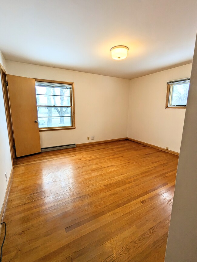 Photo 2 of the master bedroom shows off a scenic street view. - 910 Maple St