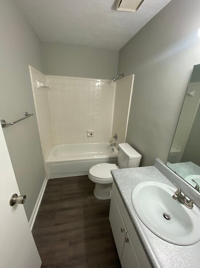 Building Photo - Freshly Remodeled 2 BR 2 BA Townhome Available Now! Beautiful New Flooring, Paint, And More!