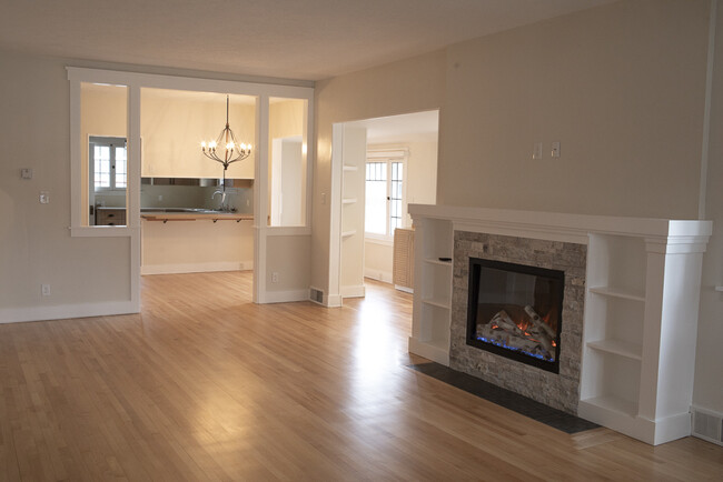 Living room with fireplace. - 715 E Lakeside Ave