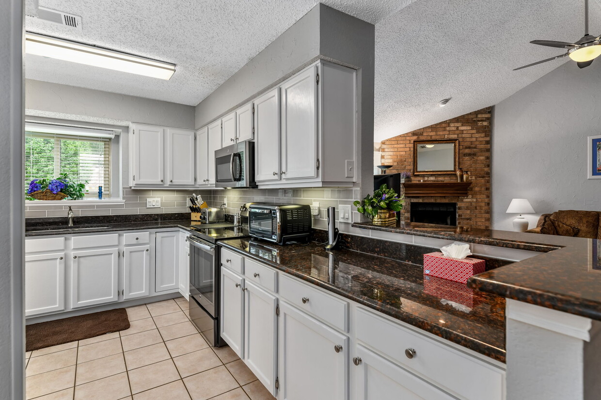 Bright & clean kitchen fully provisioned for home cooking - 7312 Augusta Cir