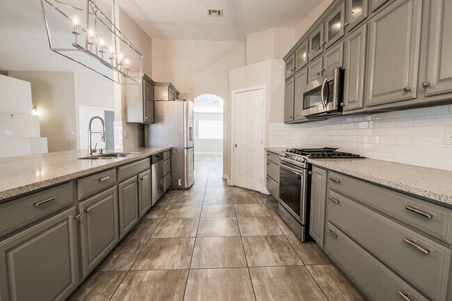 Building Photo - STUNNING 3 Bedroom Home with a 3 CAR GARAGE & RV PARKING!