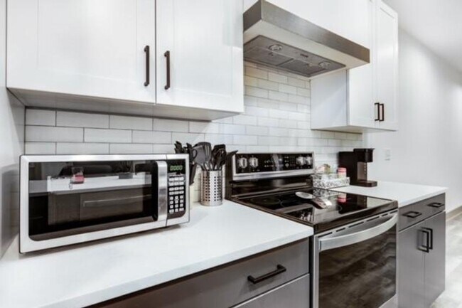 Building Photo - Modern Living Meets Walkable City Charm in...