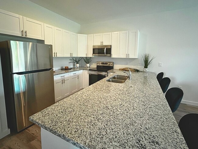 Foto del edificio - Modern Living Redefined: Luxury Duplexes i...