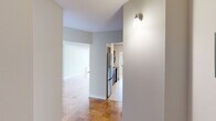 Located on the 16th floor at 185 Prospect Ave in Hackensack, NJ, this well-appointed 2-bedroom, 2-bathroom residence offers a generous, thoughtfully laid-out floor plan. Gleaming parquet wood flooring flows throughout the living areas and bedrooms, adding warmth and character to the neutral, light-toned interiors.

The expansive living room is a standout feature, bathed in natural light through floor-to-ceiling sliding glass doors that open directly onto a private balcony with sweeping views of the Hackensack skyline. A second living area provides additional flexible space, while the combined dining and living area enhances the open, airy feel of the home.

The galley-style kitchen is well-equipped, featuring rich dark wood cabinetry, granite countertops, stainless steel appliances including a refrigerator and dishwasher, and light tile flooring. It opens conveniently toward the dining area.

Both bedrooms are generously sized, filled with natural light from large windows framing outdoor views, and complemented by polished parquet floors. The spacious primary bedroom offers ample room for a full furniture arrangement. Both bathrooms are clean and functional, each featuring a tiled tub-shower combination.

With seven closets distributed throughout, hallway connections between key areas, and a private balcony, this residence combines practical storage and comfort with elevated high-floor living.