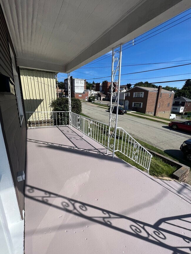 Newly painted porch - 116 W Virginia Ave