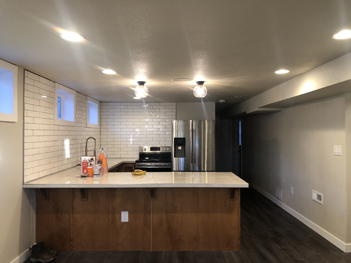 Kitchen with Tile Backsplash - 3727 Dillon Ave