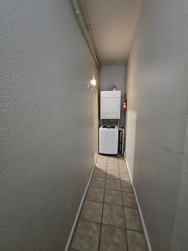 Building Photo - This updated and welcoming condo in the he...