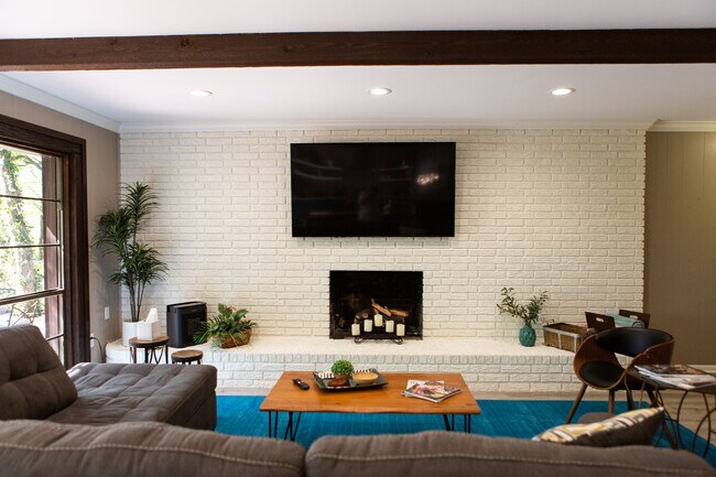 Living area seats 8 and has a smart 4G TV. - 967 Greenwood Ln