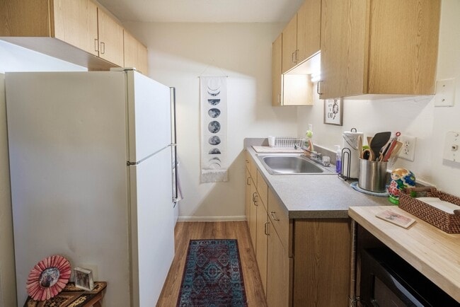 Kitchens have full size fridge and space saver oven/stove. - Circa Properties