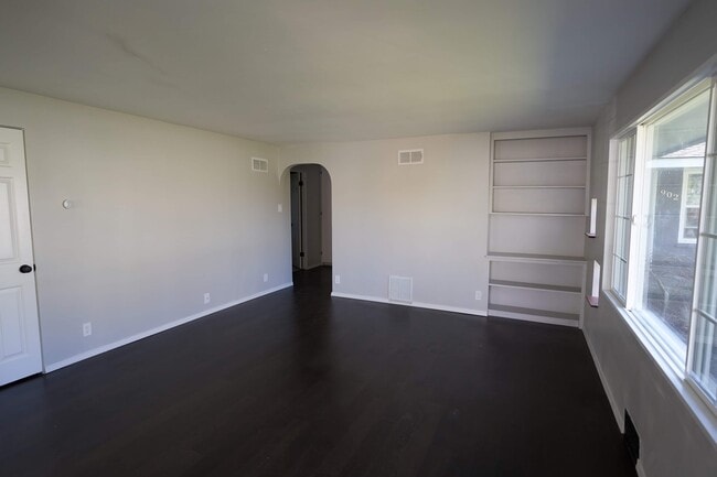 View from front door on the left is adoor that leads to two bedrooms the bathroom and a built in closet - 904 S Junett