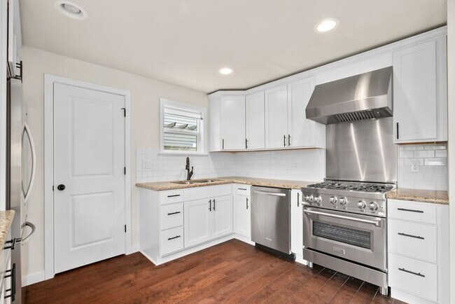 Building Photo - Timeless Remodeled Craftsman in Trendy Mad...