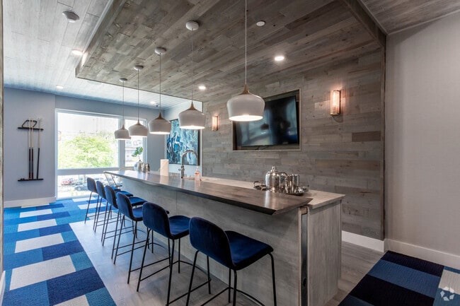 Área del bar y salón - Aura at City Crossing