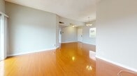 Located at 1171 Allen Ave in Glendale, CA, this well-appointed 2-bedroom, 2-bathroom residence offers a thoughtfully designed single-level layout. Rich, polished hardwood flooring flows consistently throughout the living areas and bedrooms, adding warmth and visual continuity to the space.

The living room serves as a central gathering area, anchored by a classic brick fireplace with a white mantel and complemented by a window that brings in natural light. It opens toward a dining area illuminated by a hanging chandelier, creating a welcoming flow between spaces.

The kitchen is equipped with stainless steel appliances—including a gas range, dishwasher, and refrigerator—set against granite-style countertops and crisp white cabinetry. Light tile flooring and a window over the sink keep the space bright and functional.

Both bedrooms are generously sized, each featuring large windows that frame outdoor views and invite ample natural light. The primary bedroom includes mirrored sliding closet doors, while a dedicated walk-in closet with wrap-around shelving provides excellent storage capacity.

The two bathrooms are finished with light tile flooring and marble-style vanity countertops. One bathroom features a full soaking tub with shower, while the second offers a standalone shower stall—both appointed with brushed gold fixtures for a cohesive look throughout.
