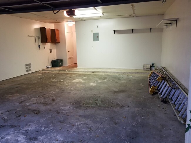 Full two car garage with garage door opener, washer/dryer connectoons. - 7235 Rimwood St