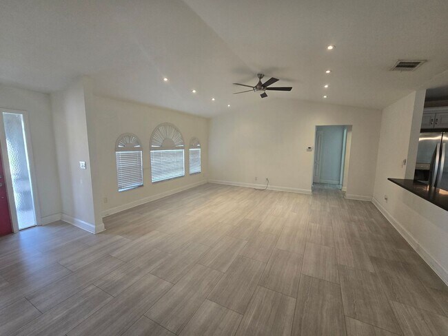 Building Photo - 3 Bedroom W/ Den + Office Space + 2 Car Garage and Fenced in Yard - Annual Rental