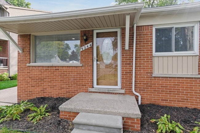 Exterior storm door and front overhang to keep your packages dry from rain! - 9244 Northern Ave