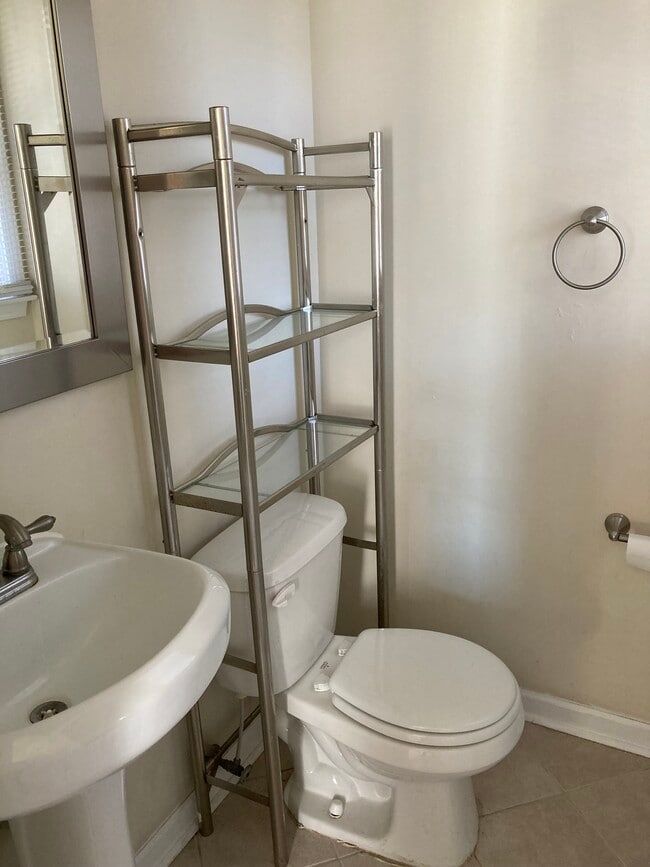 Half bath in primary bedroom - 7288 Beechtree Ln