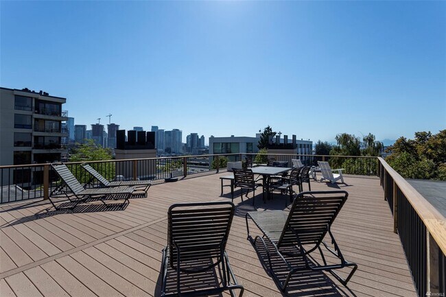 Look the other way from your rooftop lounge chair and see the glittering Seattle skyline - 730 Bellevue Ave E
