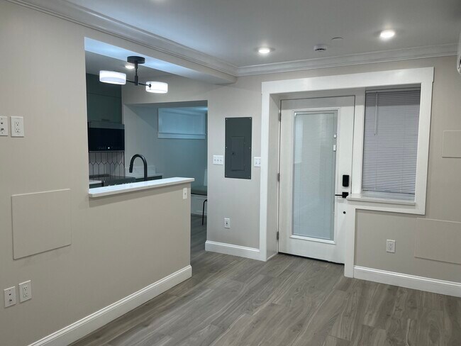 Living room looking towards the kitchen and front entrance - 1110 4th St NE