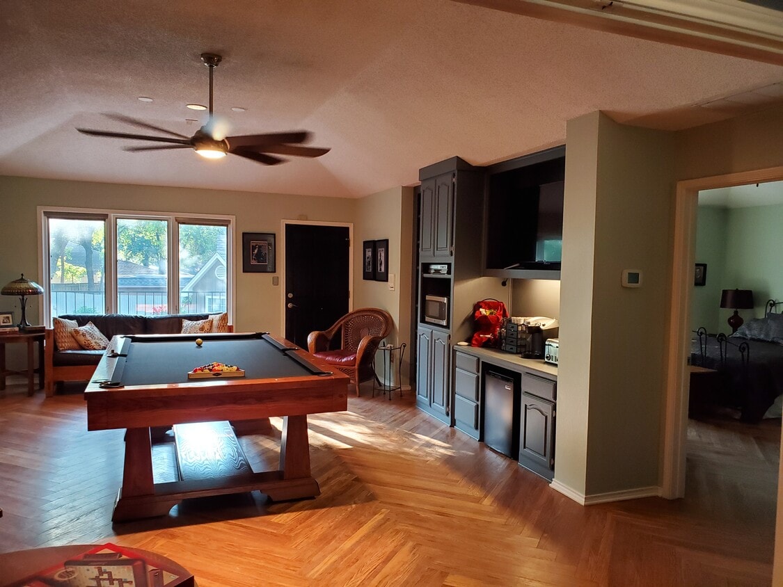 Primary living and dining area. Kitchenette is on the right wall. Entrance is the door to the righ - 504 Oak Hollow Ln