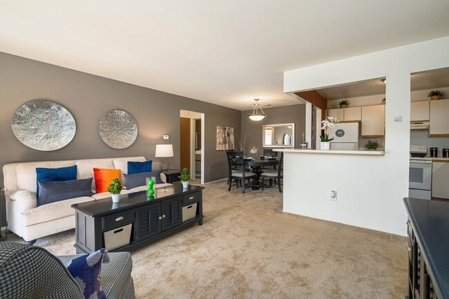 Open and airy living and dining room with all-natural light at Park Lane Apartments in Southfield, MI - Park Lane Apartments