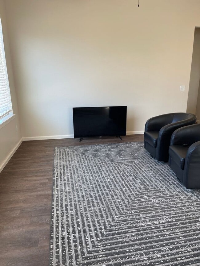 Building Photo - *Fully Furnished* 4 bedroom, 2.5 bathroom, 2 car garage Gated Neighborhood