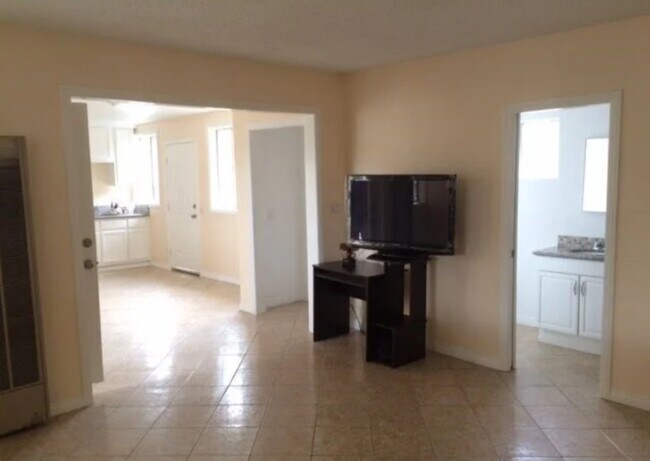 Shows bathroom entrance and laundry area - 6420 Makee Ave