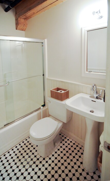 Second guest bathroom. Glass shower doors, pedestal sink and built-in medicine cabinet. - 150 Liverpool Street