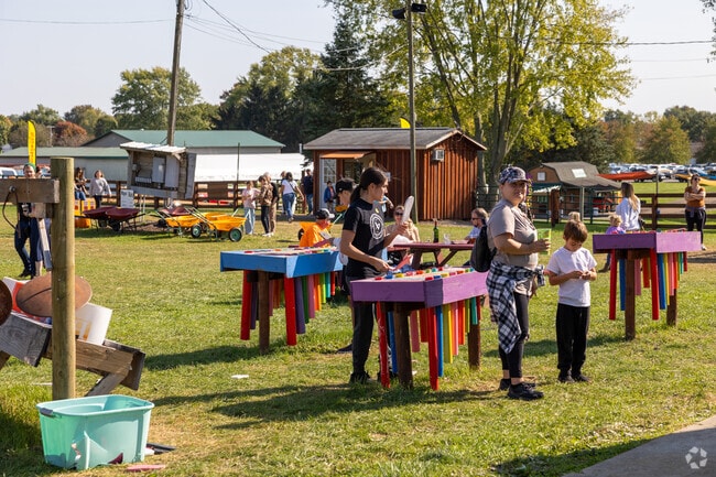 Children enjoy playing on DIY instruments at the Maize Valley Fall Harvest.