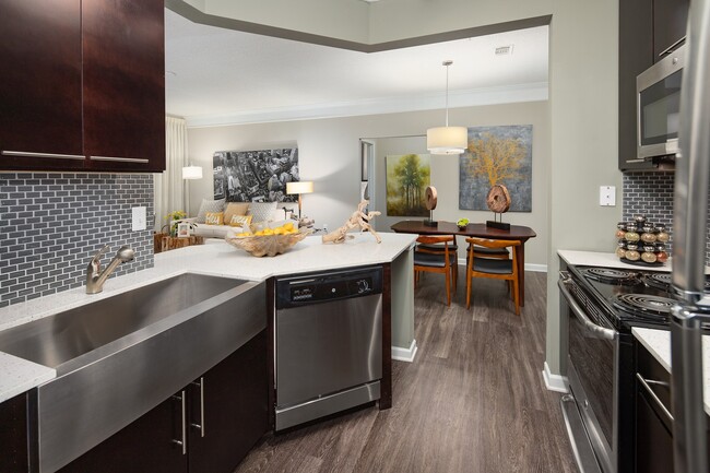 Our chef-inspired kitchens feature stainless steel appliances. - Windsor Johns Creek