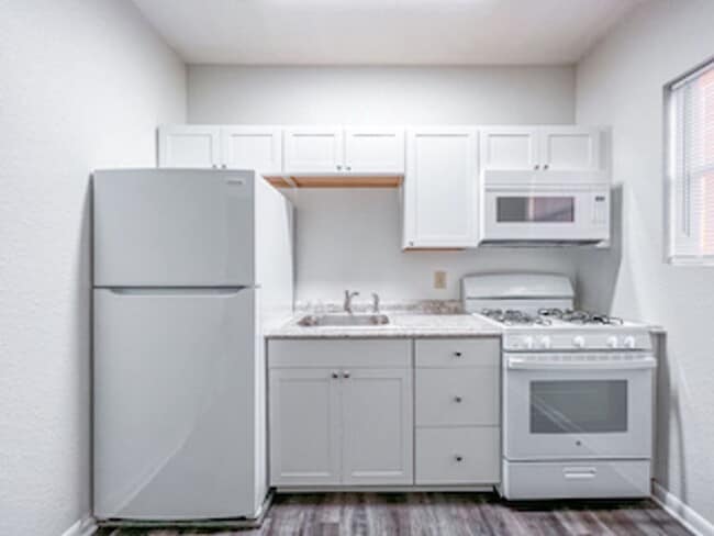 Building Photo - Corner Unit Available! unit 204