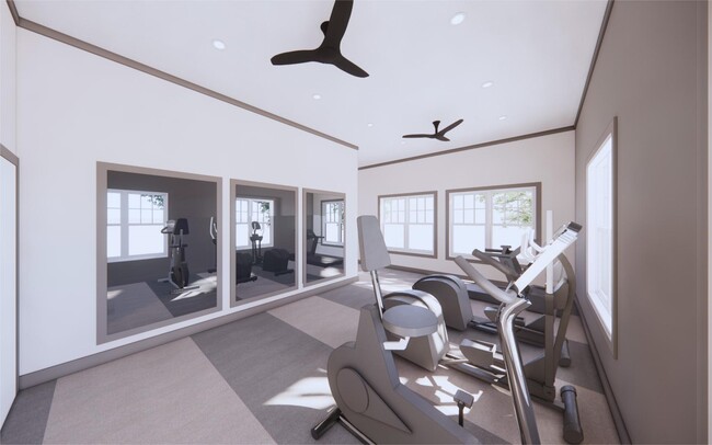 Maintain your wellness routine with on-site cardio and weight equipment. - The Mark Townhomes