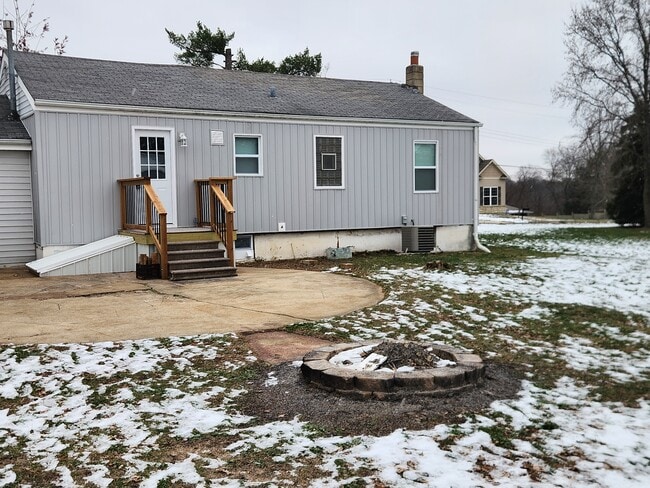 Back of house with deck that leads to a patio entertaining space and spacious back yard area. - 13131 East Ln