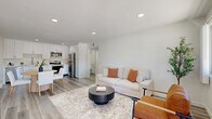 Located at 44150 35th St W in Lancaster, CA, this single-floor, 3-bedroom, 2-bathroom home offers a clean, modern aesthetic with thoughtful finishes throughout. The open-concept living and kitchen area serves as the heart of the home, featuring light wood-look flooring, recessed lighting, and crisp white walls that create a bright, airy atmosphere. The kitchen is well-appointed with white shaker cabinetry, stainless steel appliances including a refrigerator, range, microwave, and dishwasher, complemented by a stainless sink and ample counter space. A dedicated dining area flows naturally from the kitchen. The living area offers a comfortable, welcoming layout with a window providing natural light and views of the outdoors. Three bedrooms are finished with the same light wood flooring and neutral white walls, offering versatile, move-in-ready spaces. Each bedroom includes closet storage. The two bathrooms feature full tub-shower combinations with clean white surrounds, vanities, and wood-look flooring. A hallway connects the rooms efficiently, and a balcony provides an outdoor retreat. The overall design is modern and minimalist, ideal for those seeking a well-maintained, functional home in Lancaster.