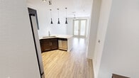 Located at 5001 White Settlement Rd in Fort Worth, TX, this well-appointed one-bedroom, one-bathroom residence offers a thoughtfully designed single-level layout. The open living area features wood-look flooring and double glass doors that invite natural light, creating a bright and welcoming atmosphere. The kitchen is a standout, equipped with rich dark cabinetry featuring glass-front upper doors, stainless steel appliances including an electric range and over-the-range microwave, granite countertops, a deep undermount sink, and a sleek tile backsplash, all accented by contemporary pendant lighting. A built-in mudroom nook near the entry provides practical storage with a bench, cubbies, and an upper cabinet. The bedroom offers plush carpet flooring, a ceiling fan, and a window with blinds for natural light and privacy. The bathroom showcases a dark-framed vanity mirror, granite countertop with an undermount sink, and a full tub-shower combo enclosed in floor-to-ceiling charcoal tile with built-in shelving. A dedicated closet and hallway complete this efficiently organized home, making it an ideal space for comfortable single-occupant living.