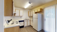 Located at 3675 Cross Ridge Ln in Canal Winchester, Ohio, this two-floor property offers a practical and comfortable layout designed for everyday living. The kitchen is thoughtfully arranged in an L-shaped configuration, featuring light wood cabinetry with ample upper and lower storage, white appliances including a refrigerator, electric range, and dishwasher, and a double basin sink. Light wood-look flooring runs throughout the kitchen, complemented by a textured ceiling and bright overhead fluorescent lighting. The neutral color palette keeps the space feeling open and clean. The remaining rooms feature soft wall-to-wall carpeting in a light gray tone, providing a warm and quiet atmosphere. Large windows fitted with horizontal blinds allow natural light to fill the interior, enhancing the airy feel of each room. Warm-toned baseboards and neutral wall colors contribute to a cohesive and inviting aesthetic throughout. With two floors of living space, this property offers ample room for a variety of needs, all within the welcoming community of Canal Winchester, Ohio.