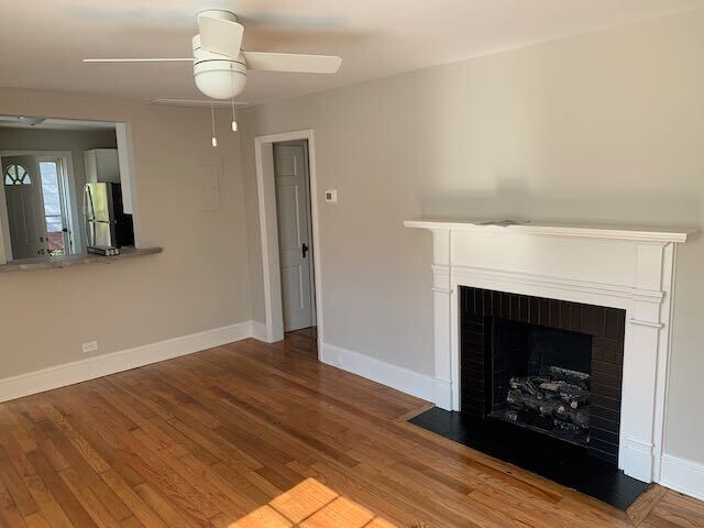 living room with fireplace - 317 E Whitaker Mill Rd