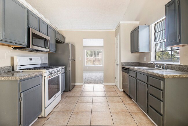 Building Photo - Rare Find: 4 Bedroom + 3 Bathroom + 2-Car ...