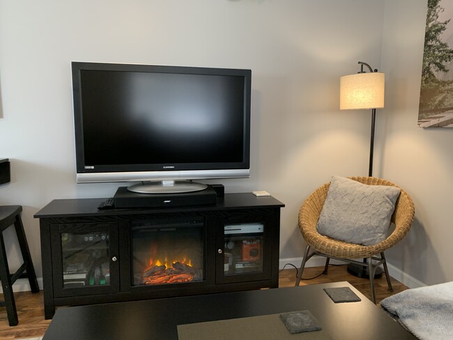 Chair in corner next to fireplace/TV stand - 1433 E. Edgemont Avenue